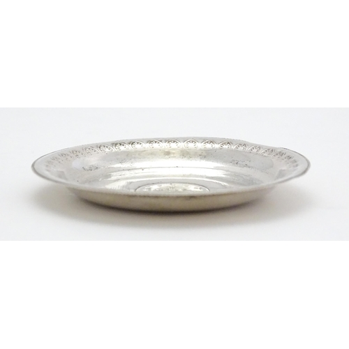 279 - A .800 silver / white metal pin dish of circular form with Ottoman coin style detail to centre. Appr... 