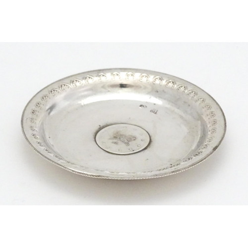 279 - A .800 silver / white metal pin dish of circular form with Ottoman coin style detail to centre. Appr... 