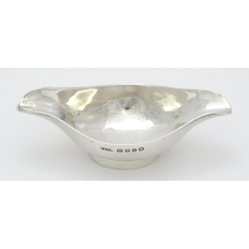 280 - A silver double spouted bowl / medicine feeder, hallmarked London 1935 with Jubilee mark, maker F & ... 