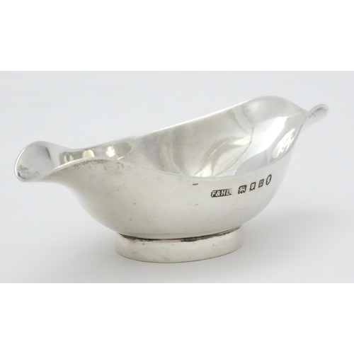 280 - A silver double spouted bowl / medicine feeder, hallmarked London 1935 with Jubilee mark, maker F & ... 