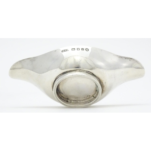 280 - A silver double spouted bowl / medicine feeder, hallmarked London 1935 with Jubilee mark, maker F & ... 