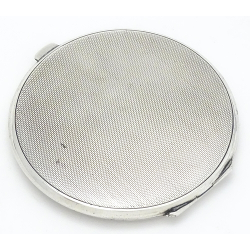 285 - An Art Deco silver compact with engine turned decoration bearing military insignia to lid for RAF 61... 