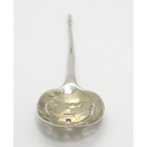 354 - An 18thC silver mote spoon, indistinctly marked. Approx. 5