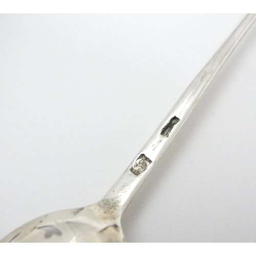 354 - An 18thC silver mote spoon, indistinctly marked. Approx. 5