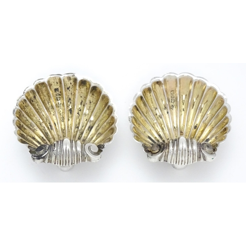 390 - A pair of Victorian silver salts of scallop shape hallmarked Birmingham 1893, maker Joseph Whitten. ... 