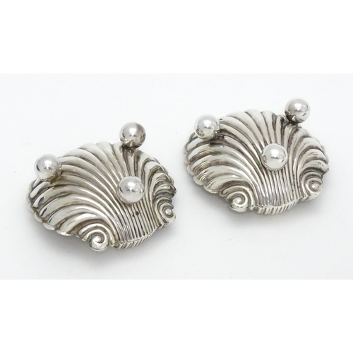 390 - A pair of Victorian silver salts of scallop shape hallmarked Birmingham 1893, maker Joseph Whitten. ... 