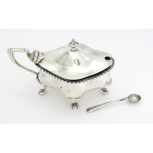 264 - A silver mustard pot of shaped form hallmarked Birmingham 1912, maker Fattorini & Sons Ltd. Together... 