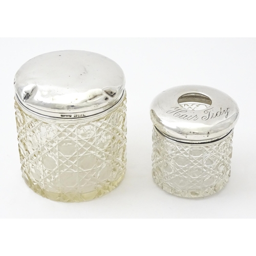 295 - A cut glass dressing table jar with silver lid hallmarked Birmingham 1902, maker J. Collyer & Co. td... 