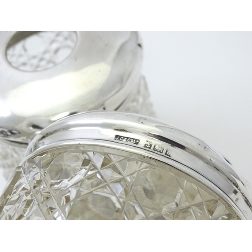 295 - A cut glass dressing table jar with silver lid hallmarked Birmingham 1902, maker J. Collyer & Co. td... 