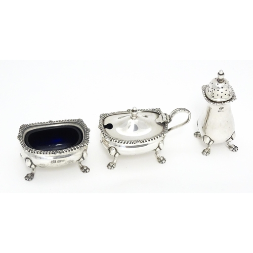 300 - A silver three piece cruet set comprising salt, pepper and mustard, hallmarked Birmingham 1961 / 196... 