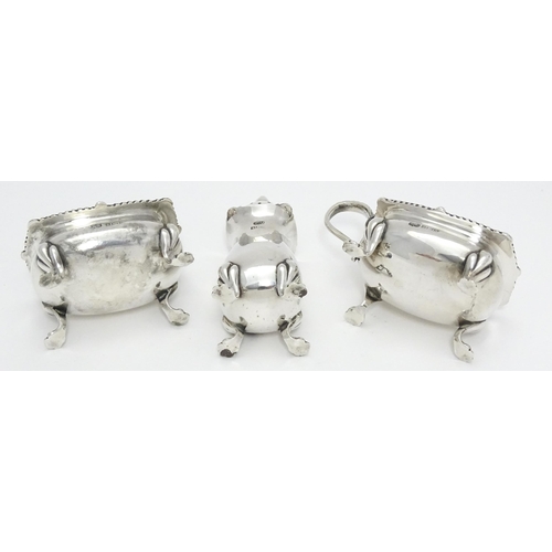 300 - A silver three piece cruet set comprising salt, pepper and mustard, hallmarked Birmingham 1961 / 196... 