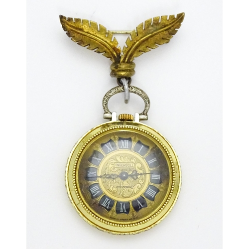 799 - An Ingersoll fob watch with floral decoration to case and with a gilt metal hanger. The watch 1 1/4