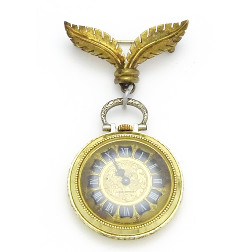 799 - An Ingersoll fob watch with floral decoration to case and with a gilt metal hanger. The watch 1 1/4