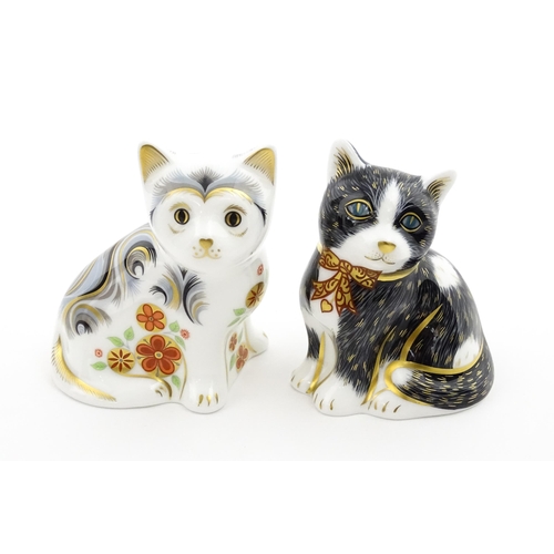 113 - Two Royal Crown Derby paperweights modelled as seated cats, one titled Black & White Kitten. Marked ... 