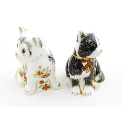 113 - Two Royal Crown Derby paperweights modelled as seated cats, one titled Black & White Kitten. Marked ... 