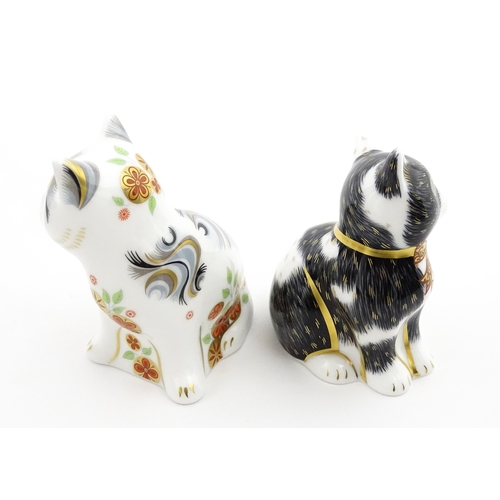 113 - Two Royal Crown Derby paperweights modelled as seated cats, one titled Black & White Kitten. Marked ... 