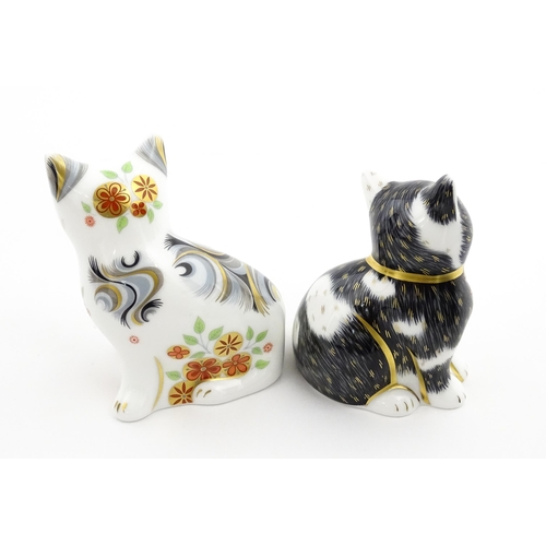 113 - Two Royal Crown Derby paperweights modelled as seated cats, one titled Black & White Kitten. Marked ... 