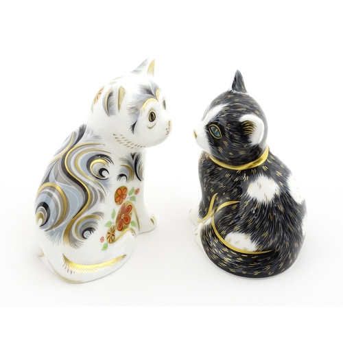 113 - Two Royal Crown Derby paperweights modelled as seated cats, one titled Black & White Kitten. Marked ... 