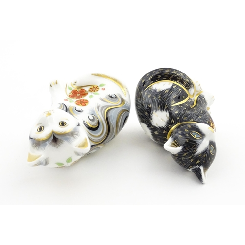 113 - Two Royal Crown Derby paperweights modelled as seated cats, one titled Black & White Kitten. Marked ... 