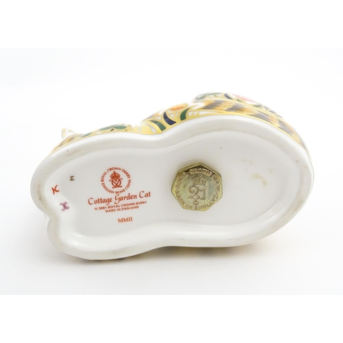 115 - Two Royal Crown Derby paperweights modelled as cats, one titled Cottage Garden Cat. Marked under. Bo... 