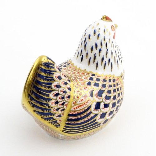 116 - A Royal Crown Derby paperweight modelled as a chicken. Marked under. Boxed. Approx. 4