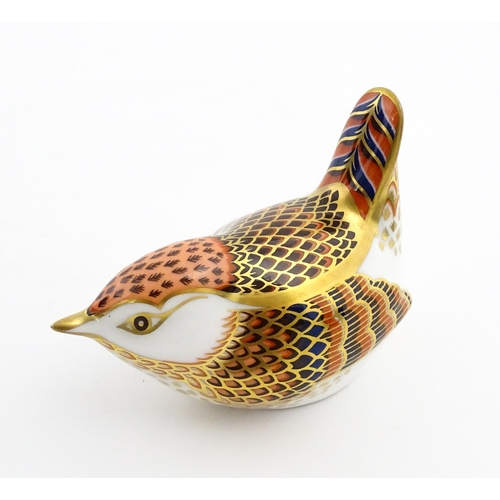 117 - A Royal Crown Derby paperweight modelled as a wren. Marked under. Boxed. Approx. 3 1/2