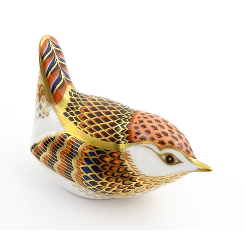 117 - A Royal Crown Derby paperweight modelled as a wren. Marked under. Boxed. Approx. 3 1/2