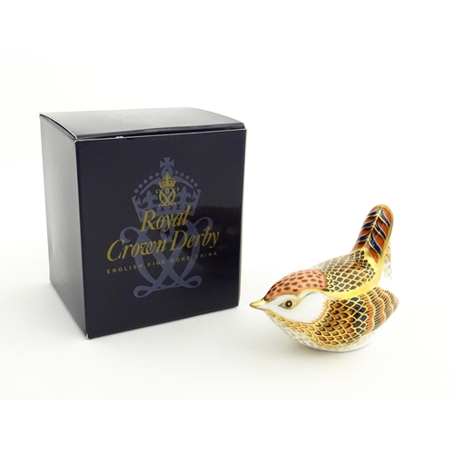 117 - A Royal Crown Derby paperweight modelled as a wren. Marked under. Boxed. Approx. 3 1/2