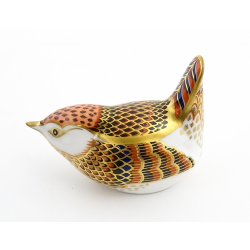 117 - A Royal Crown Derby paperweight modelled as a wren. Marked under. Boxed. Approx. 3 1/2