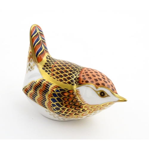 117 - A Royal Crown Derby paperweight modelled as a wren. Marked under. Boxed. Approx. 3 1/2