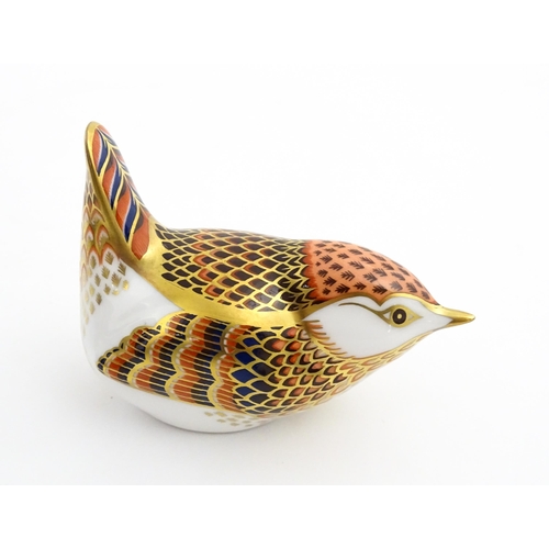 117 - A Royal Crown Derby paperweight modelled as a wren. Marked under. Boxed. Approx. 3 1/2