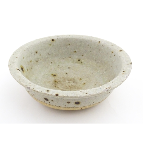 128 - Four assorted ceramic items to include a small Oriental bowl with brushwork detail, a footed dish wi... 