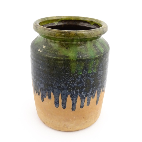 130 - A terracotta jar / vase with green drip glaze. Approx. 10 1/4