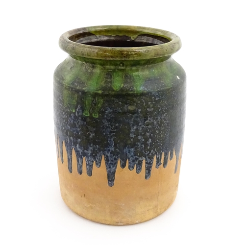 130 - A terracotta jar / vase with green drip glaze. Approx. 10 1/4