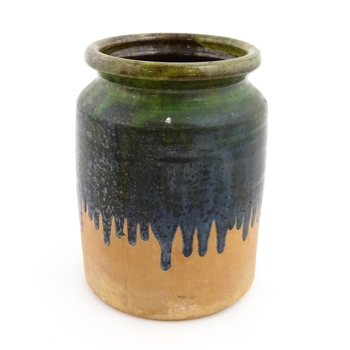 130 - A terracotta jar / vase with green drip glaze. Approx. 10 1/4