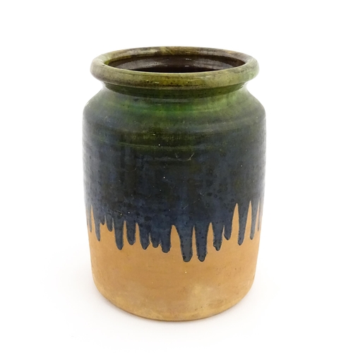 130 - A terracotta jar / vase with green drip glaze. Approx. 10 1/4