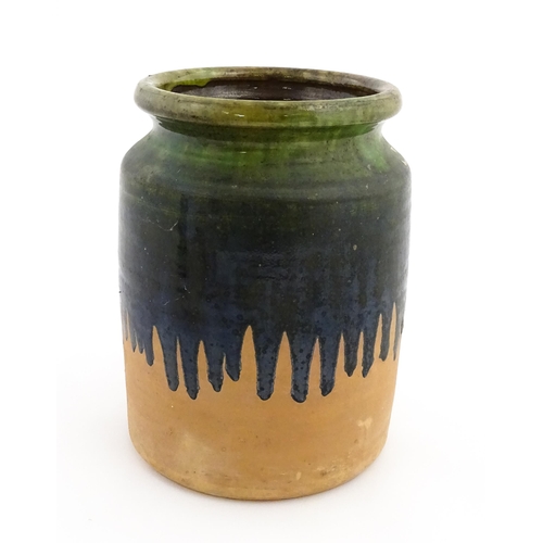 130 - A terracotta jar / vase with green drip glaze. Approx. 10 1/4