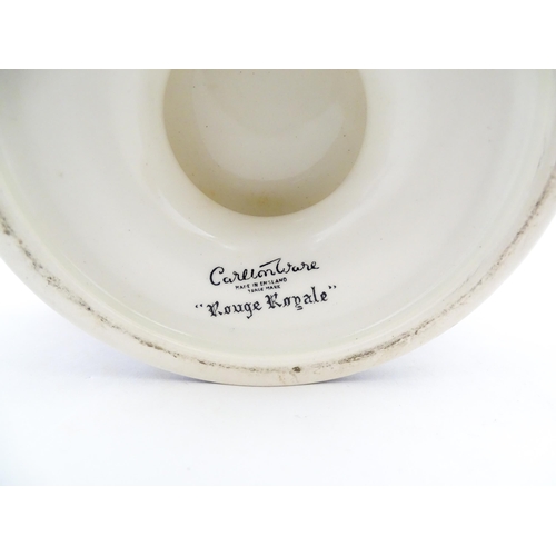 139 - A Carlton Ware pedestal bowl with twin handled and relief foliate detail. Marked under Rouge Royale.... 