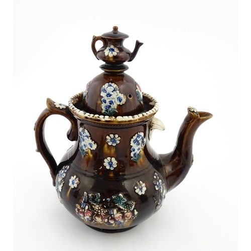 145 - A large 19thC Measham bargeware teapot bearing a plaque with the motto A Present for a Friend, decor... 