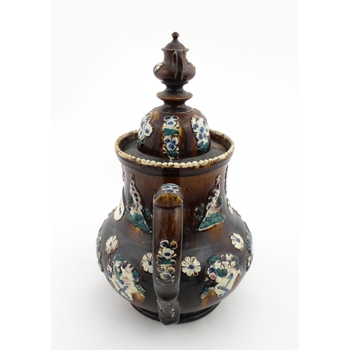 146 - A large 19thC Measham bargeware teapot bearing a plaque for P. R. Greatorex 1891, decorated with fru... 