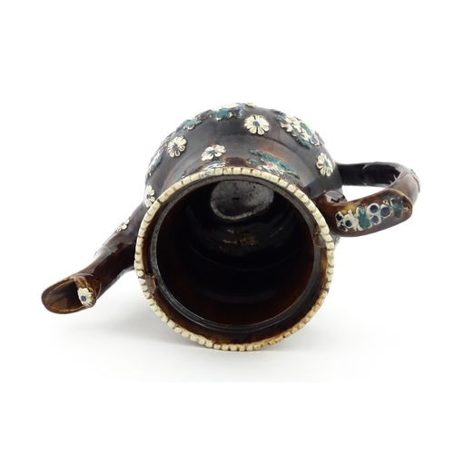 146 - A large 19thC Measham bargeware teapot bearing a plaque for P. R. Greatorex 1891, decorated with fru... 