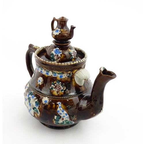 147 - A 19thC Measham bargeware teapot bearing a plaque A Present to Mr A Dawson and Wife Mansfield, decor... 