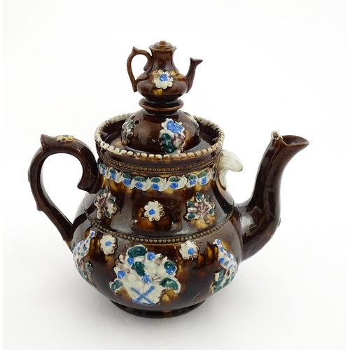 147 - A 19thC Measham bargeware teapot bearing a plaque A Present to Mr A Dawson and Wife Mansfield, decor... 