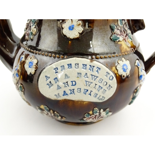 147 - A 19thC Measham bargeware teapot bearing a plaque A Present to Mr A Dawson and Wife Mansfield, decor... 