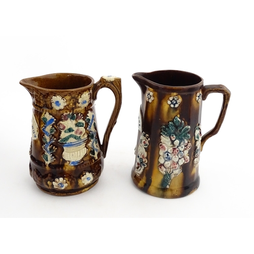 148 - Two 19thC Measham bargeware jugs with floral and foliate decoration, both bearing the motto Forget M... 