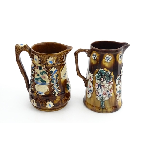 148 - Two 19thC Measham bargeware jugs with floral and foliate decoration, both bearing the motto Forget M... 