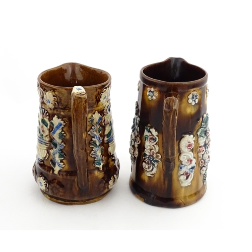 148 - Two 19thC Measham bargeware jugs with floral and foliate decoration, both bearing the motto Forget M... 