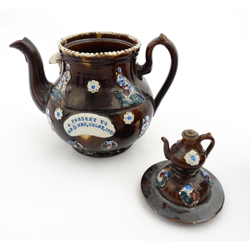 152 - A 19thC Measham bargeware teapot decorated with birds, flowers and foliage, bearing a plaque for 'A ... 