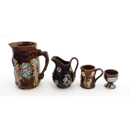 155 - Four items of 19thC Measham bargeware to include a jug floral and foliate detail and the motto A Pre... 