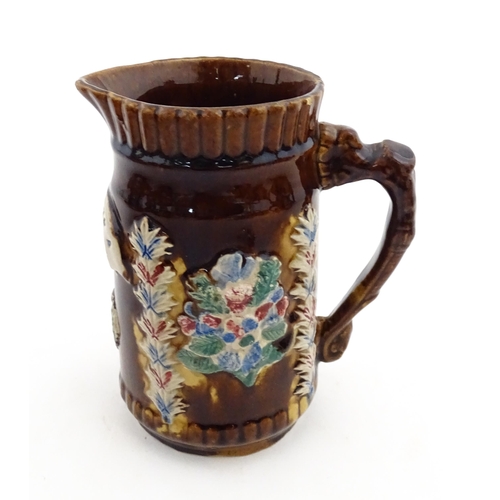 155 - Four items of 19thC Measham bargeware to include a jug floral and foliate detail and the motto A Pre... 